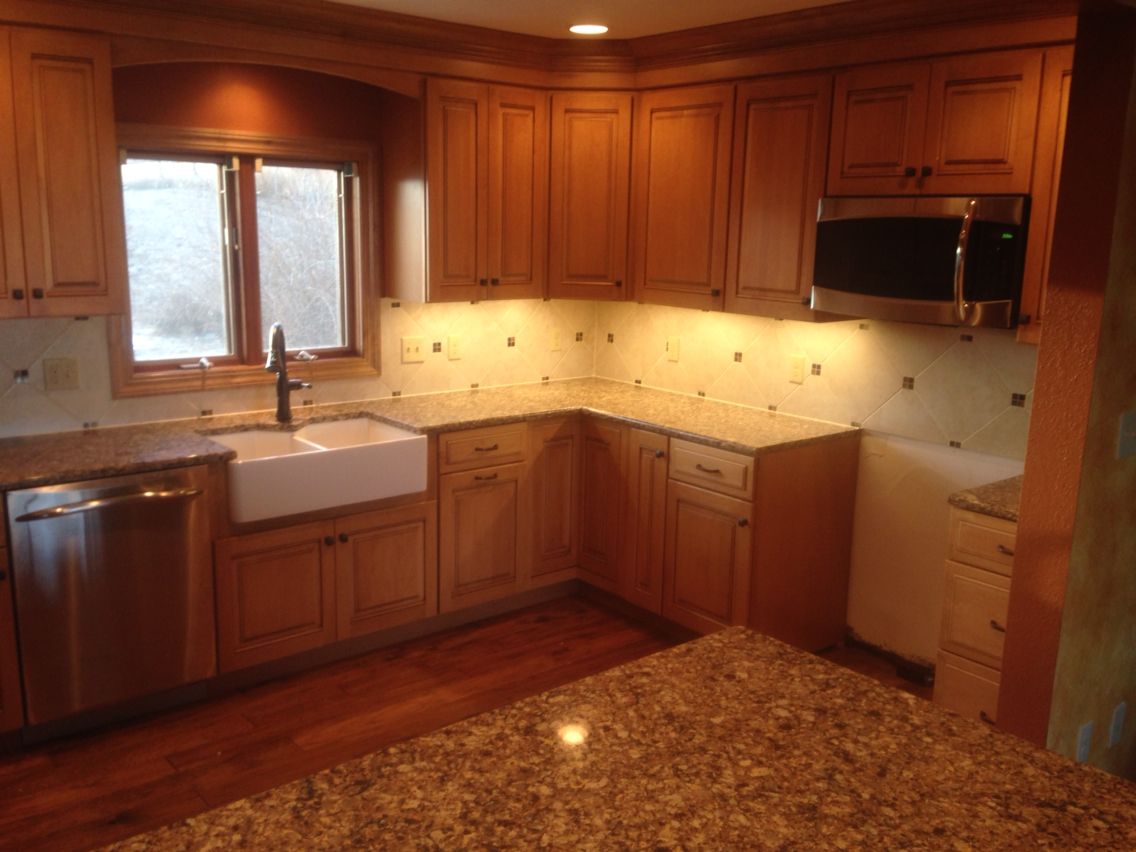 Maple cabinets are out. Farmhouse sinks and tile backsplashes are in.